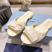 PRADA 26S RUCHED BOW SLIDE SANDALS IN IVORY WHITE CALFSKIN