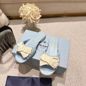 PRADA 26S RUCHED BOW SLIDE SANDALS IN LIGHT BLUE CALFSKIN
