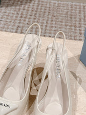 PRADA 26S POINTED-TOE SLINGBACK HEELS 75MM IN LIGHT BEIGE PATENT CALFSKIN