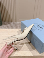 PRADA 26S POINTED-TOE SLINGBACK HEELS 75MM IN LIGHT BEIGE PATENT CALFSKIN