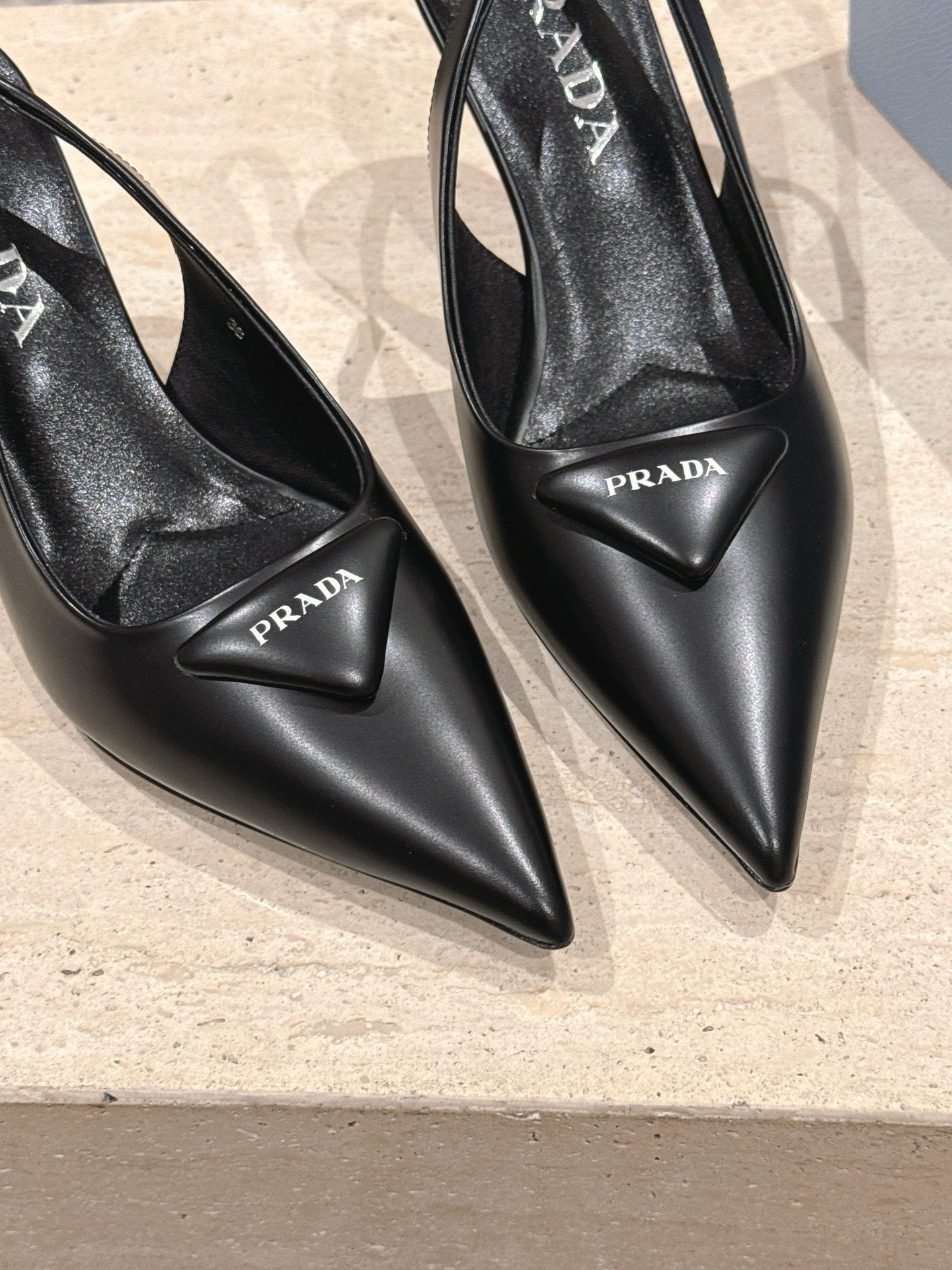 PRADA 26S POINTED-TOE SLINGBACK HEELS 75MM IN BLACK SHINY CALFSKIN