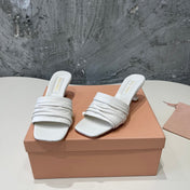 HIGH - HEEL WHITE SHEEPSKIN WITH STYLIZED STRAPS