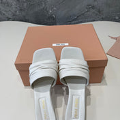 HIGH - HEEL WHITE SHEEPSKIN WITH STYLIZED STRAPS