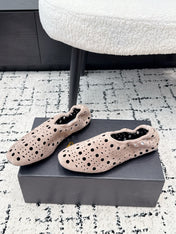 ALAIA 26S FLAT SLIP-ONS IN NUDE PINK SUEDE WITH OPENWORK PATTERN