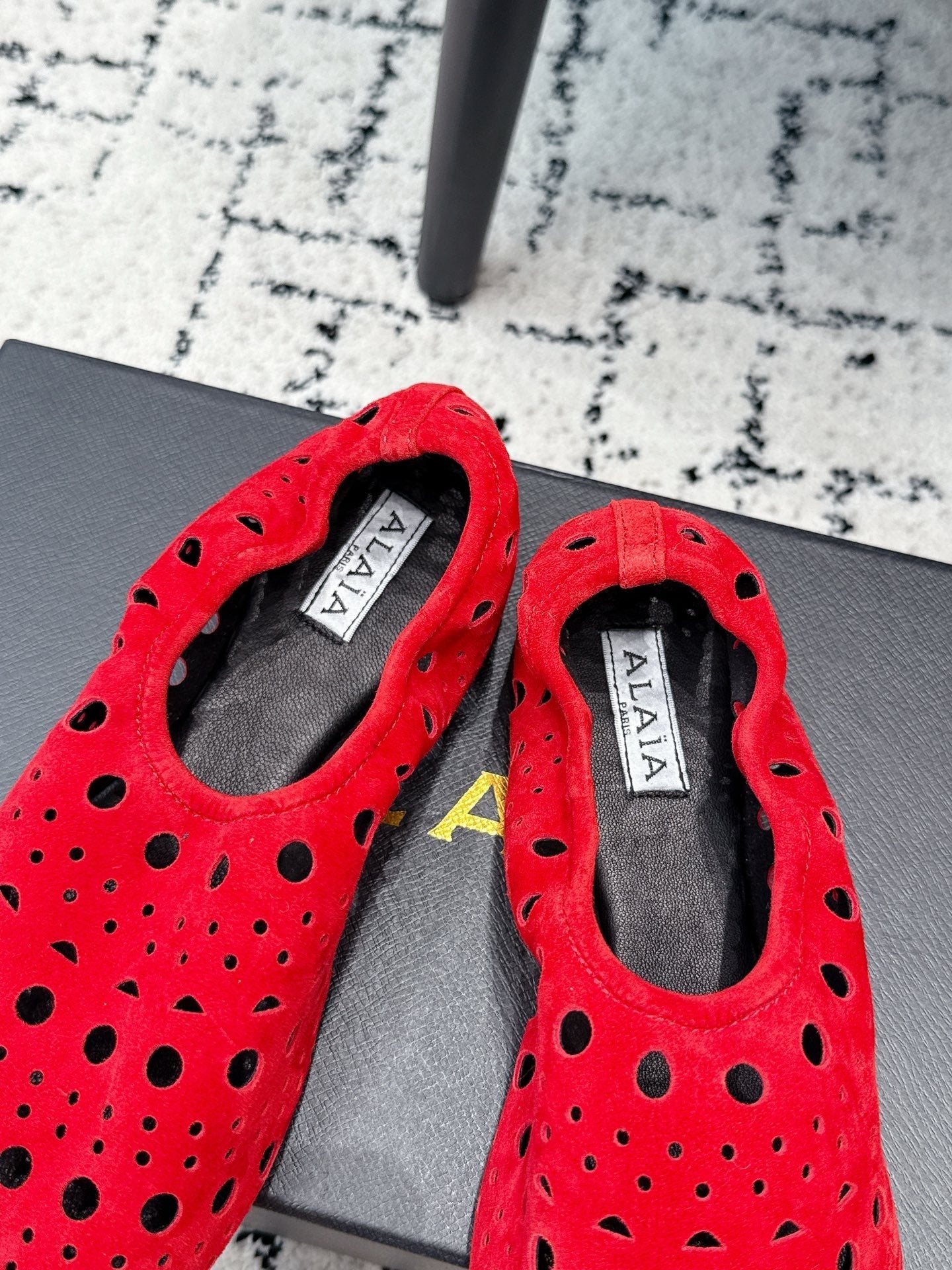 ALAIA 26S FLAT SLIP-ONS IN RED SUEDE WITH OPENWORK PATTERN