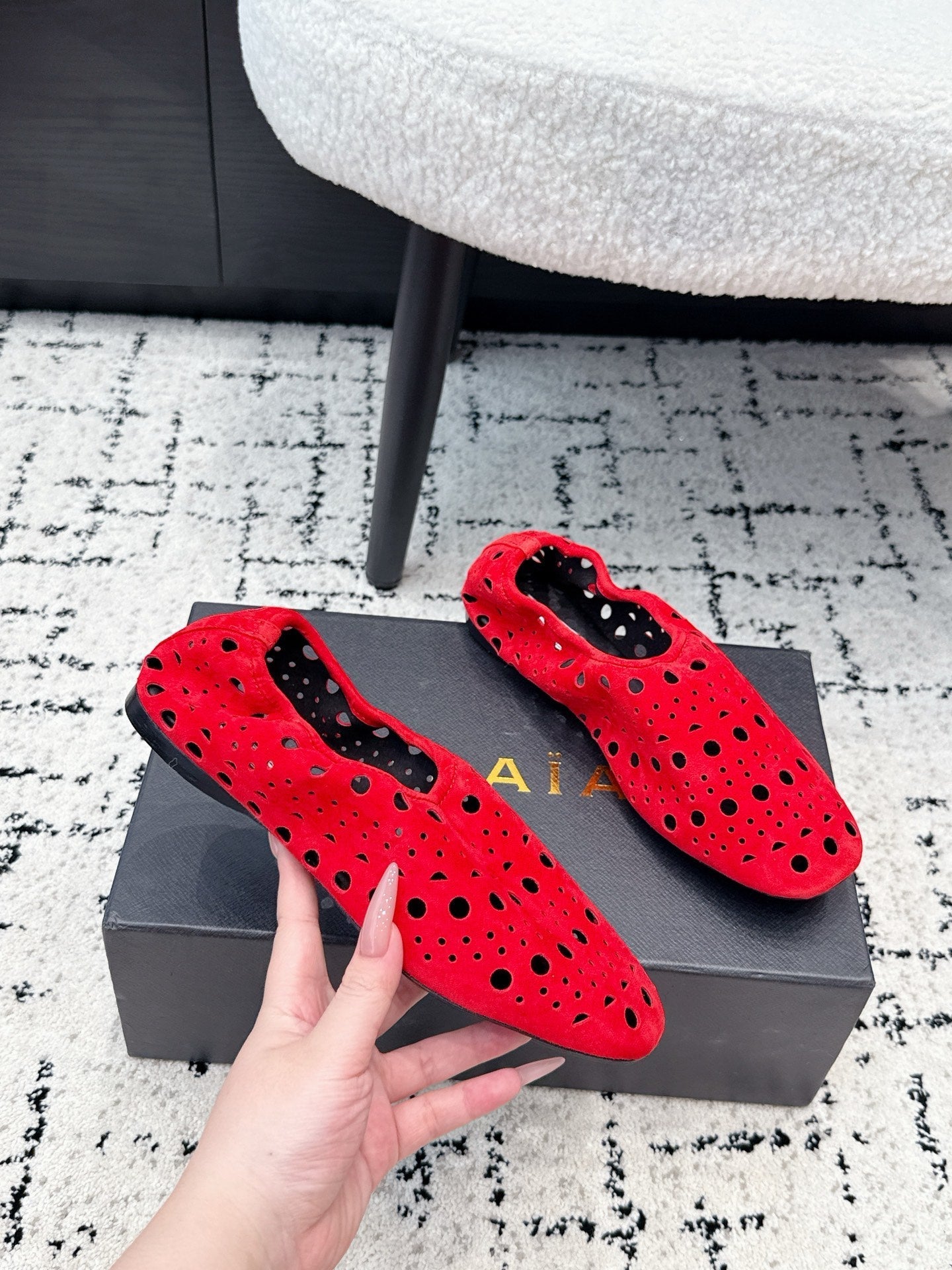 ALAIA 26S FLAT SLIP-ONS IN RED SUEDE WITH OPENWORK PATTERN