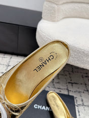 CHANEL 26S FLAT MULES IN GOLD LAMBSKIN