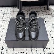 CHANEL 26S LACE-UP SNEAKERS IN BLACK FABRIC AND LAMBSKIN