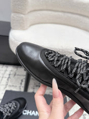 CHANEL 26S LACE-UP SNEAKERS IN BLACK FABRIC AND LAMBSKIN