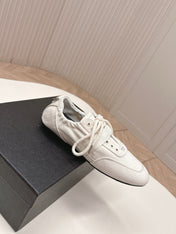 PRADA 26S LACE UP MINIMAL SNEAKERS IN WHITE CANVAS