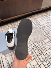 PRADA 26S BUCKLED LOAFERS IN WHITE CALFSKIN
