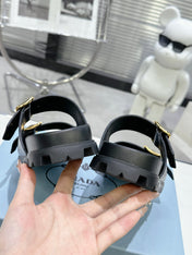 PRADA 25S STRAP SLIDES 30MM IN BLACK CALFSKIN GOLD HARDWARE