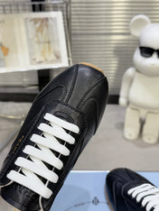 PRADA 26S LACE UP SNEAKERS IN BLACK CALFSKIN