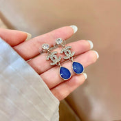CHANEL 26S DOUBLE C CRYSTAL LOGO BLUE TEXTURED TEARDROP DANGLE EARRINGS IN GOLD METAL 629183