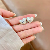 CHANEL 26S TEXTURED HEART CC LOGO STUD EARRINGS IN SILVER METAL 629192