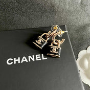CHANEL 26S DOUBLE C LOGO PADLOCK DROP EARRINGS IN GOLD & BLACK METAL 629975