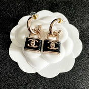 CHANEL 26S DOUBLE C LOGO PADLOCK DROP EARRINGS IN GOLD & BLACK METAL 629975