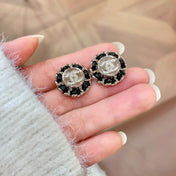 CHANEL 26S DOUBLE C LOGO BLACK ENAMEL FLORAL STUD EARRINGS IN GOLD METAL 629992