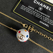 CHANEL 26S DOUBLE C LOGO WHITE ENAMEL CRYSTAL BALL PENDANT NECKLACE IN GOLD METAL 629889