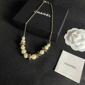 CHANEL 26S DOUBLE C LOGO PEARL BEADED BRACELET WITH CRYSTAL DETAIL IN GOLD METAL 631014