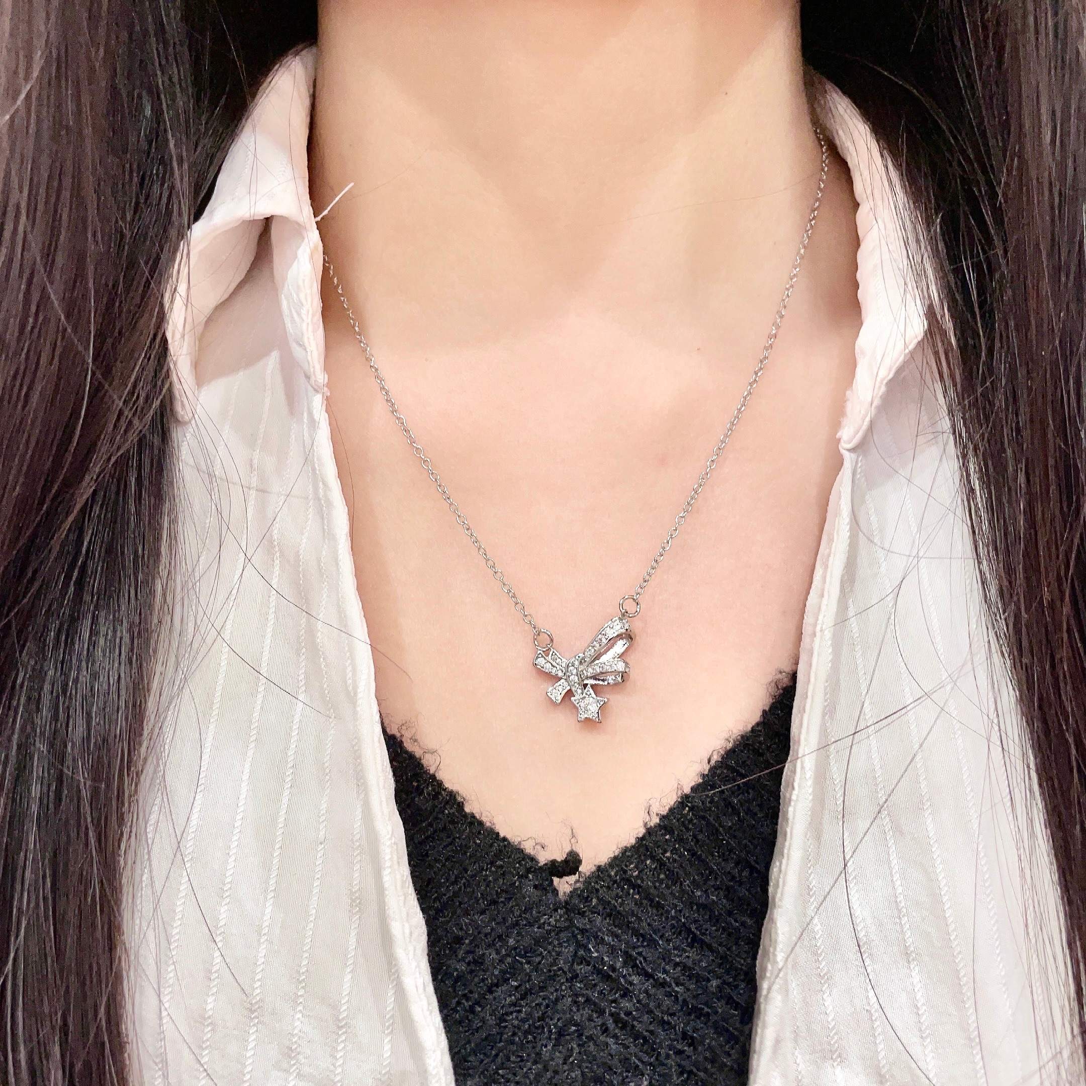 CHANEL 26S DOUBLE C LOGO CRYSTAL BOW & STAR PENDANT NECKLACE IN SILVER METAL 631019