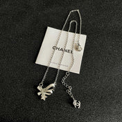 CHANEL 26S DOUBLE C LOGO CRYSTAL BOW & STAR PENDANT NECKLACE IN SILVER METAL 631019