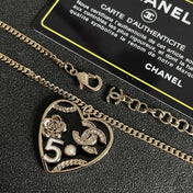 CHANEL 26S DOUBLE C LOGO HEART CHARM NECKLACE WITH NO.5 & FLORAL DETAIL IN GOLD METAL 630796