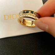 CD 26S CRYSTAL BAND LOGO RING IN GOLD TONE METAL 630811