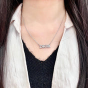CD 26S PAVE LOGO LETTER NECKLACE IN SILVER TONE METAL 631805