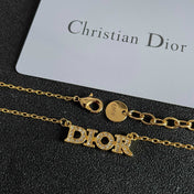 CD 26S PAVE LOGO LETTER NECKLACE IN GOLD TONE METAL 631806