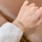 CD 26S PAVE LOGO LETTER BRACELET IN GOLD TONE METAL 631808
