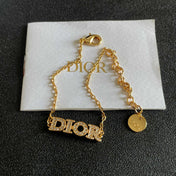 CD 26S PAVE LOGO LETTER BRACELET IN GOLD TONE METAL 631808