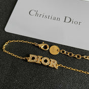 CD 26S PAVE LOGO LETTER BRACELET IN GOLD TONE METAL 631808