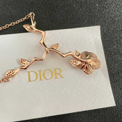 CD 26S CRYSTAL ROSE BRANCH PENDANT NECKLACE IN ROSE GOLD TONE METAL 631896