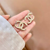 CHANEL 26S DOUBLE C LOGO CRYSTAL STUD EARRINGS IN GOLD METAL 631903