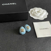 CHANEL 26S DOUBLE C LOGO OVAL STUD EARRINGS IN BLUE MARBLE ENAMEL WITH GOLD METAL 631908