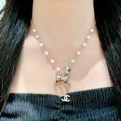 CHANEL 26S DOUBLE C LOGO FAWN CHARM NECKLACE WITH PEARL CHAIN IN GOLD METAL 633292