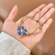 CHANEL 26S DOUBLE C LOGO BLUE ENAMEL FLOWER CHAIN BRACELET WITH CRYSTAL DETAIL IN GOLD METAL 633154