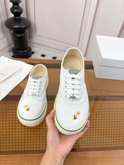 DIOR 26S LOW TOP SNEAKERS IN WHITE CANVAS WITH DAISY EMBROIDERY