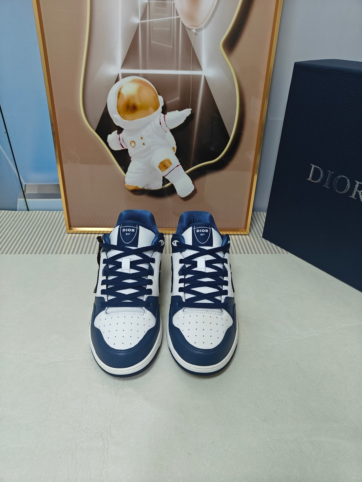 DIOR 26S LOW-TOP SNEAKER IN WHITE AND NAVY BLUE CALFSKIN