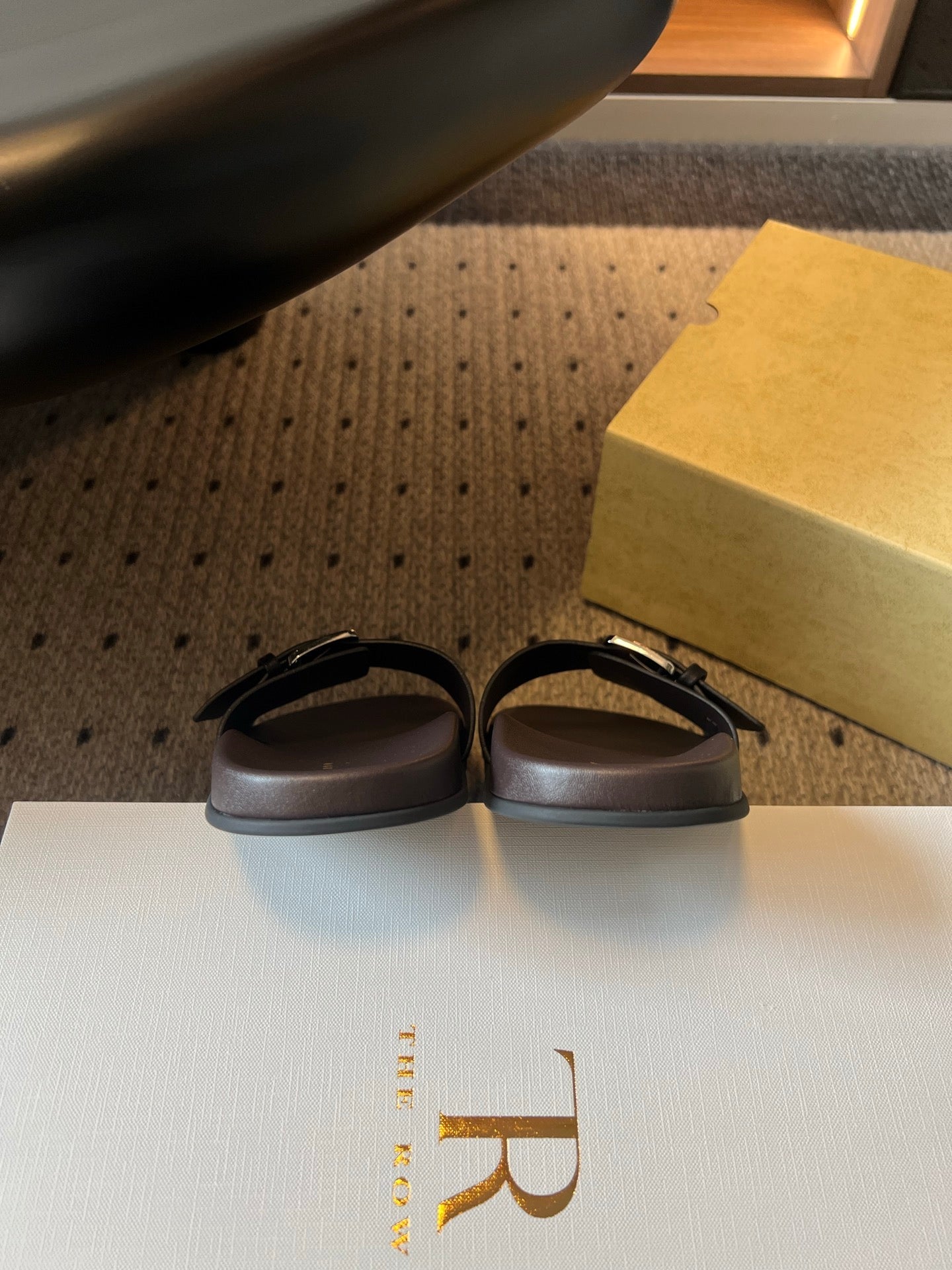 THE ROW 26S BUCKLE SLIDE SANDALS IN BLACK CALFSKIN