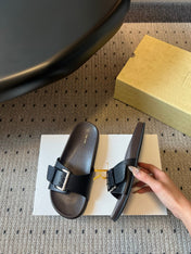 THE ROW 26S BUCKLE SLIDE SANDALS IN BLACK CALFSKIN