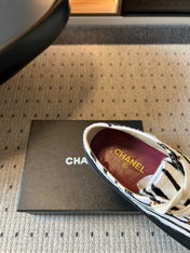 CHANEL 26S LACE UP SNEAKERS IN BLACK CALFSKIN AND WHITE PONY HAIR