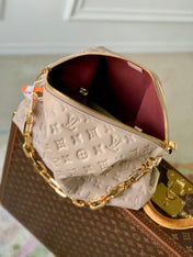 COUSSIN MM 38 IN BEIGE MONOGRAM EMBOSSED CALFSKIN GOLD HARDWARE
