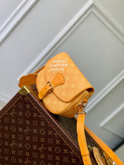 MONTSOURIS MESSENGER PM 20 IN PEPPER ORANGE MONOGRAM HERITAGE CANVAS