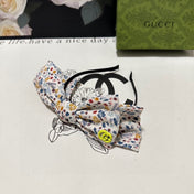 HAIRBAND IN WHITE FLORAL FABRIC 385855