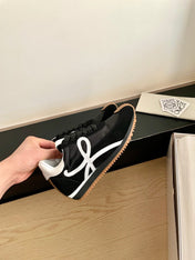 LOEWE 26S FLOW RUNNER SNEAKER IN BLACK SUEDE AND WHITE SHEEPSKIN