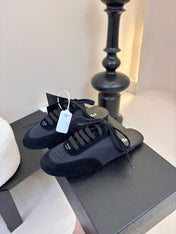 SNEAKER MULES IN BLACK NYLON AND SUEDE