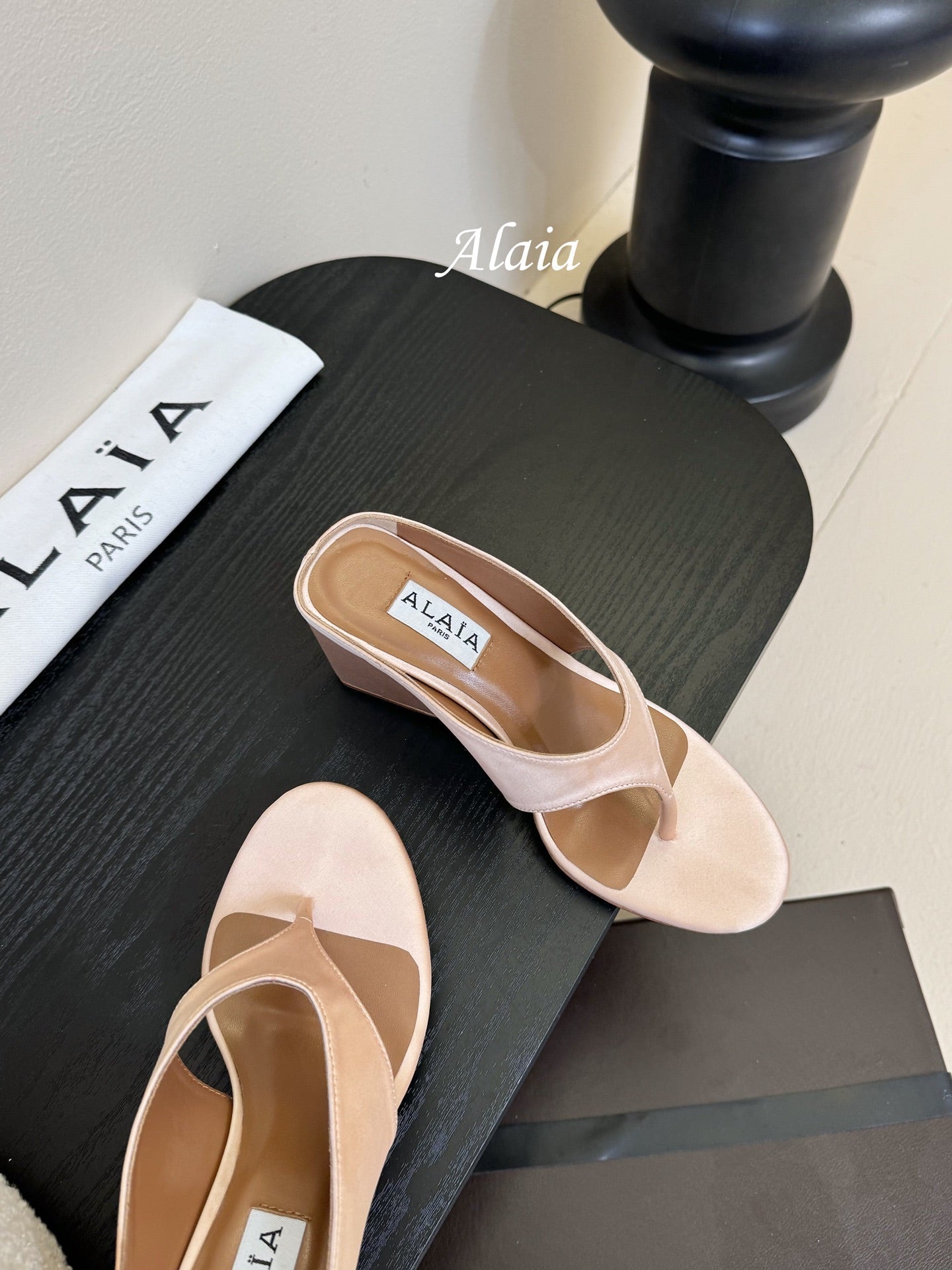 ALAIA WEDGE THONG SANDALS 25S IN BLUSH BEIGE SATIN