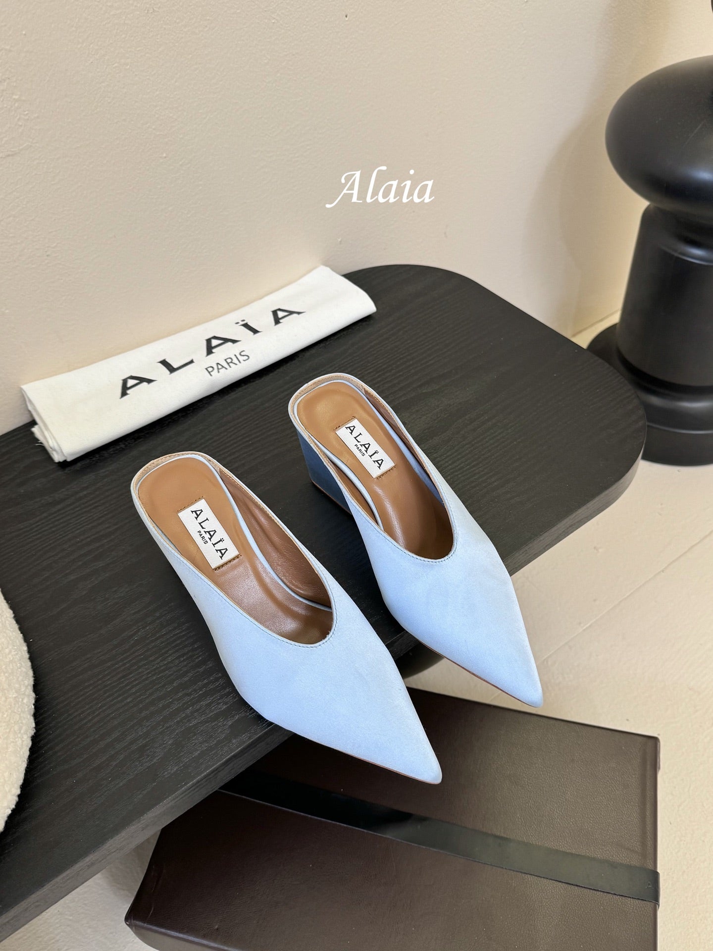 ALAIA HIGH MULES 25S IN LIGHT BLUE SATIN